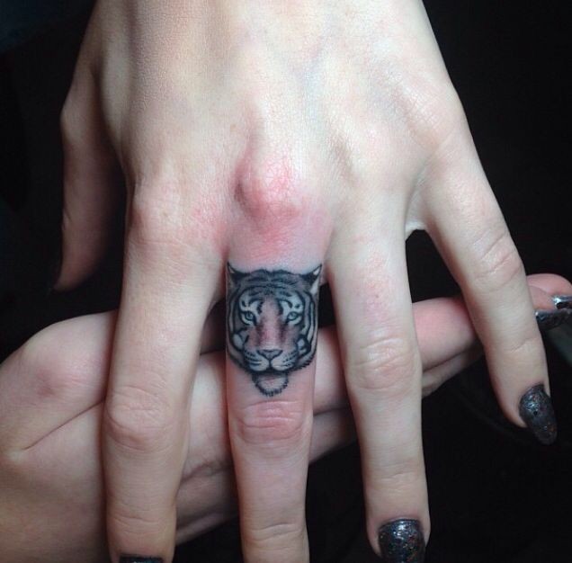 Small Tiger Face Tattoo on Middle Finger