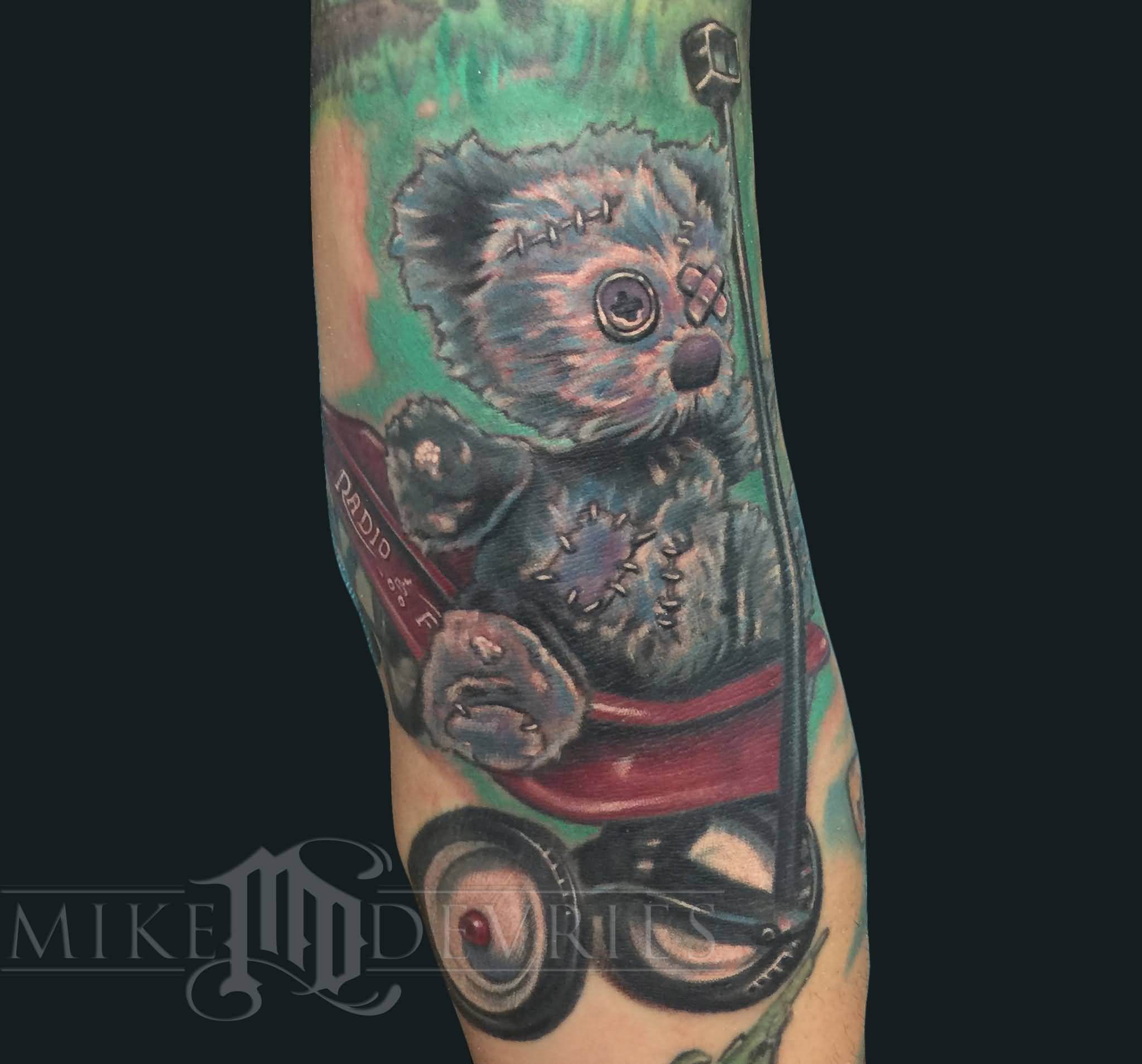 Teddy Bear On Radio Flyer Tattoo On Sleeve