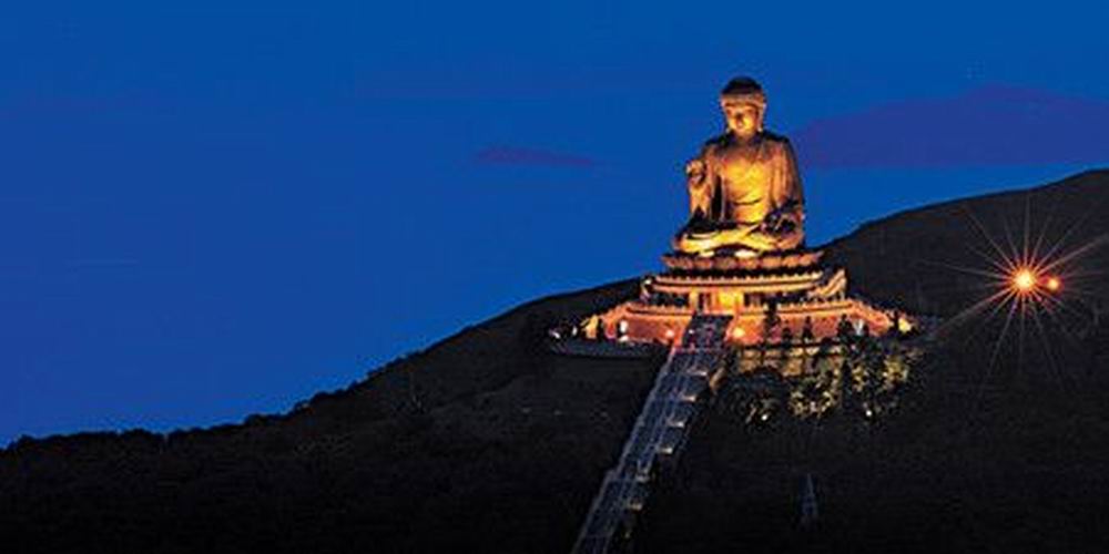 Tian Tan Buddha Statue Illuminated At Night