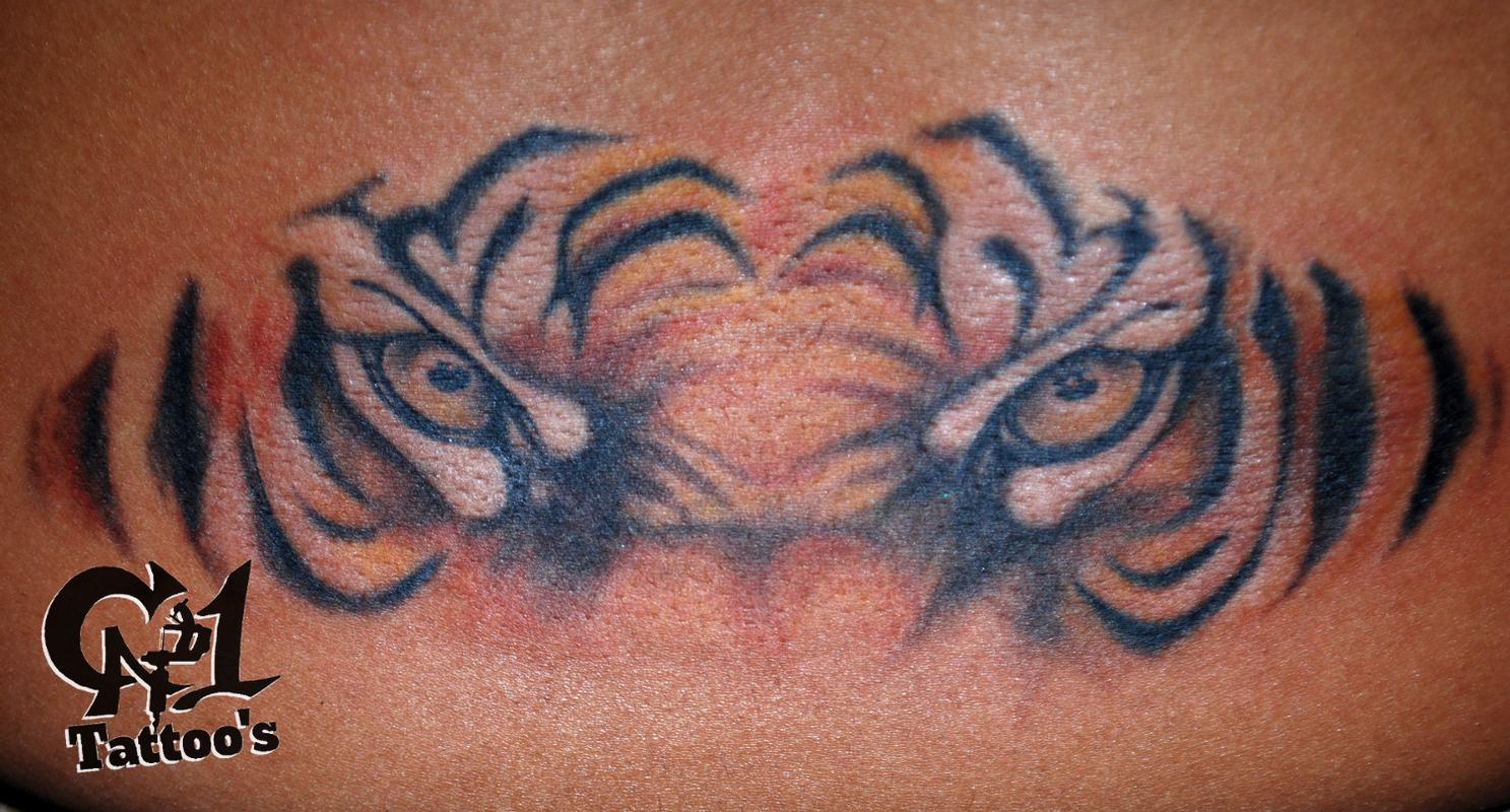Tiger Eyes Tattoo On Man Body