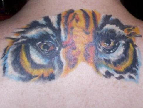 Tiger Eyes Tattoo On Upper Back For Men