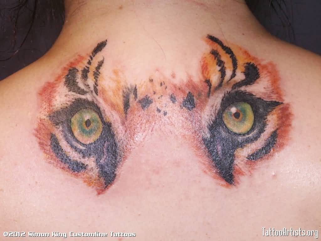 Tiger Eyes Tattoo On Upper Back