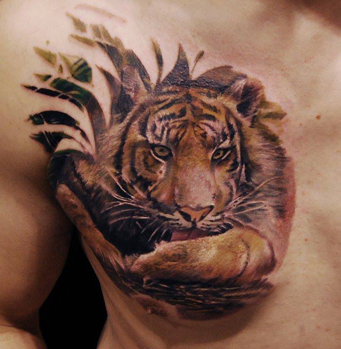 Tiger Licking His Paw Tattoo On Chest