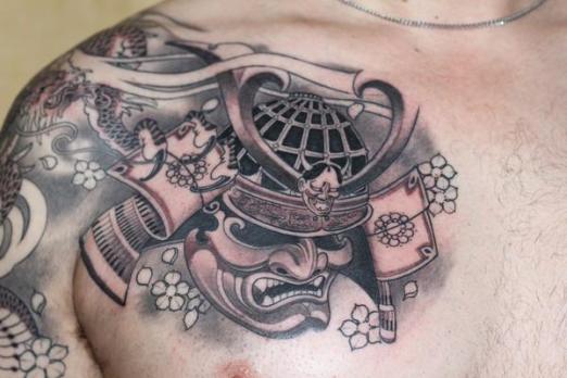 Traditional Black Ink Samurai Head Tattoo On Man Right Chest