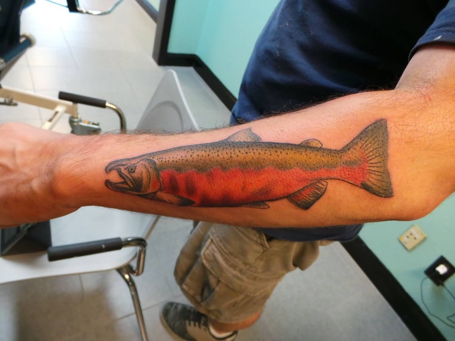 Traditional Fish Tattoo On Man Left Arm By Roger McMahon
