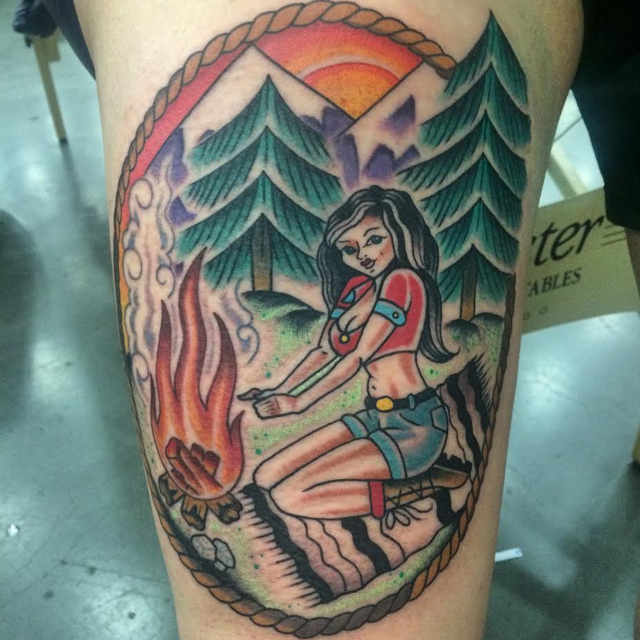Traditional Girl With Bonfire In Rope Frame Tattoo On Leg