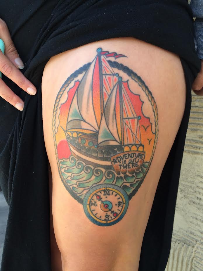 Traditional Ship With Compass In Rope Frame Tattoo On Girl Left Side Thigh