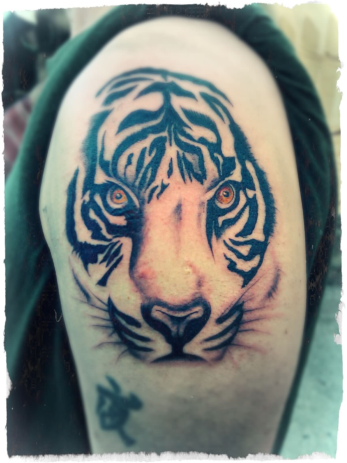 Tribal Tiger Face Tattoo On Left Shoulder