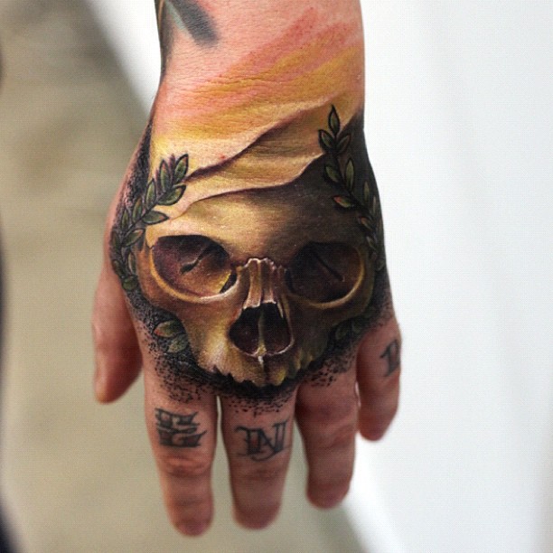Unique Skull Tattoo On Left Hand By Mick Squires