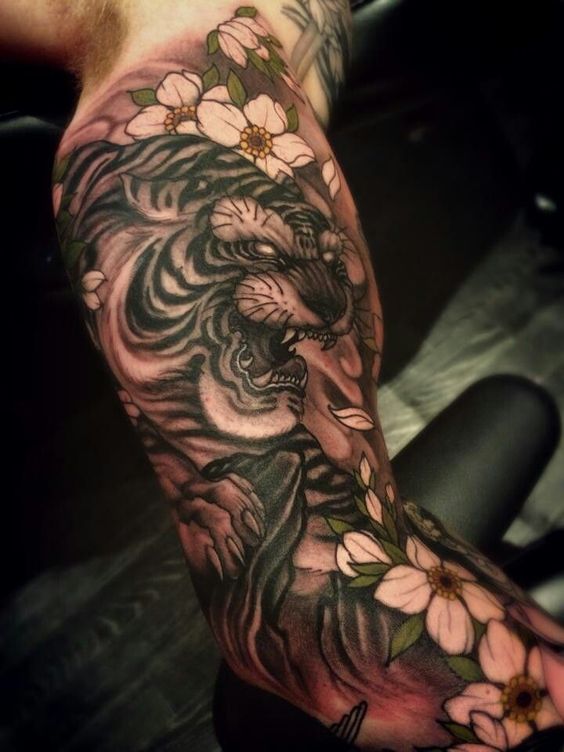 White Flowers And Chinese Tiger Head Tattoo On Bicep