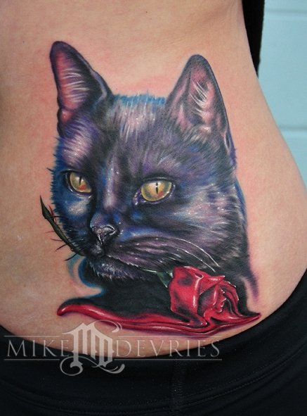Wonderful Rose In Cat Mouth Tattoo On Side Rib By Mike Devries