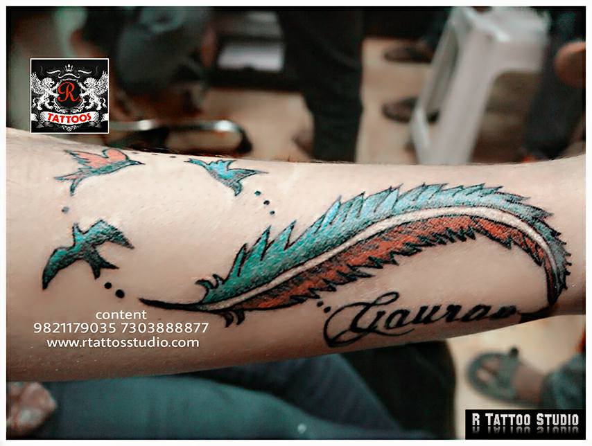 bird tattoos with feather tattoos - colorful feather tattoos
