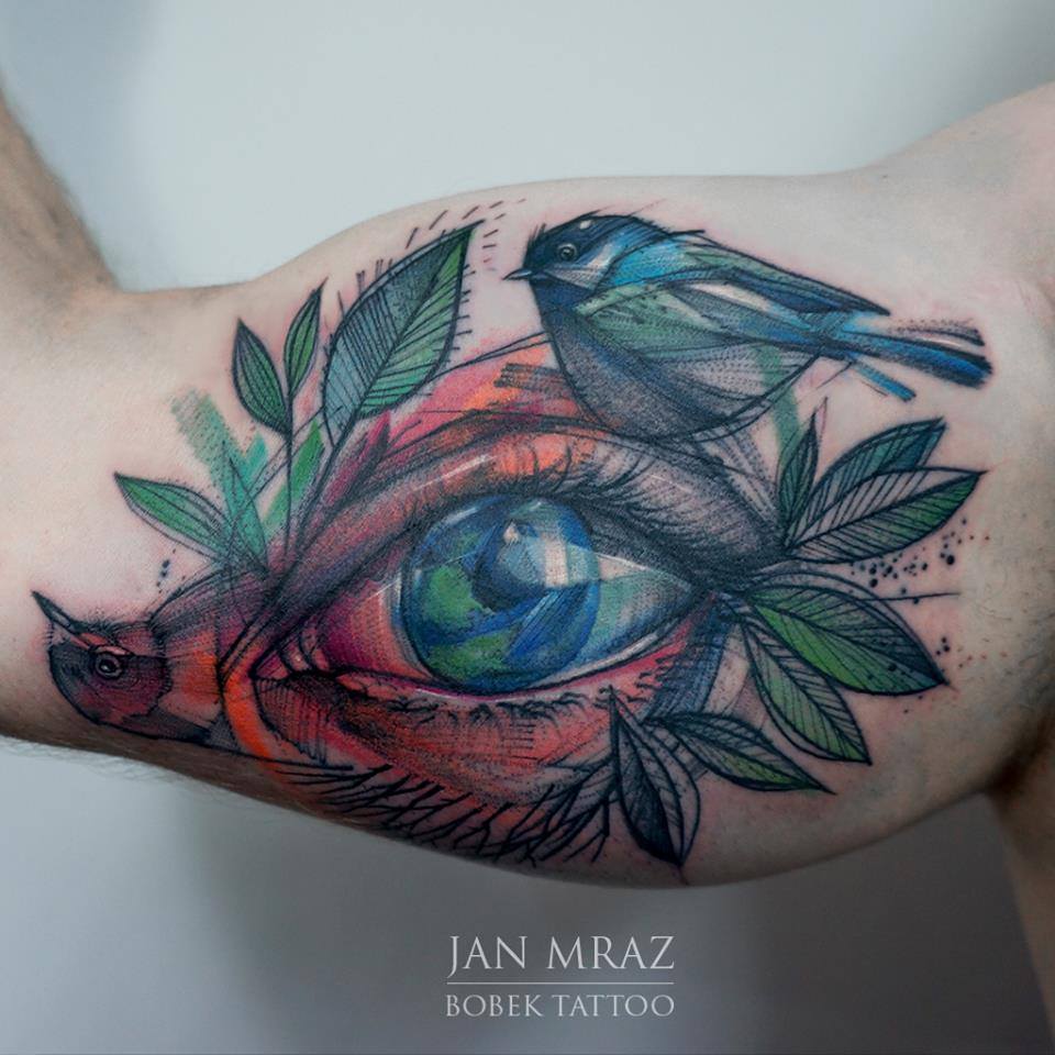 Abstract Bird With Eye Tattoo On Right Bicep By Jan Mraz