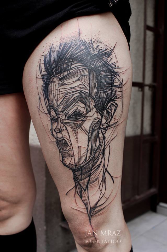 Abstract Egon Schiele Face Tattoo On Left Thigh