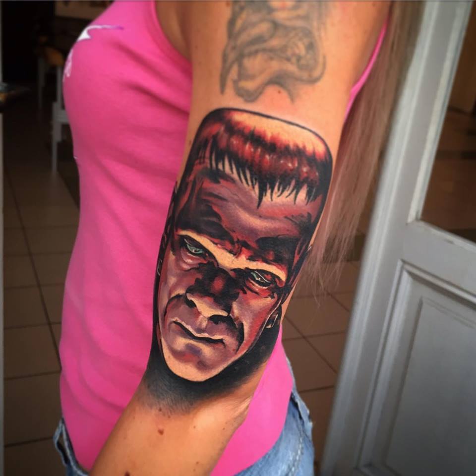 Abstract Frankenstein Head Tattoo On Women Left Half Sleeve