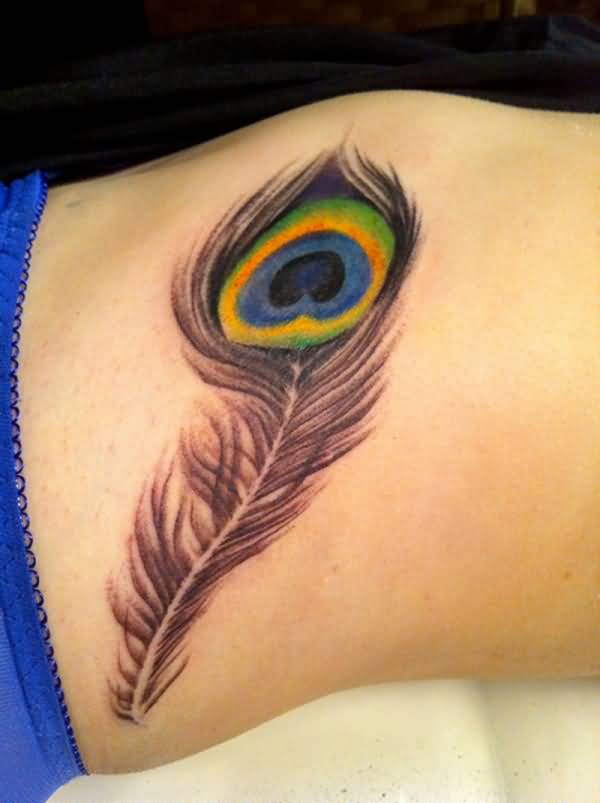 Amazing Side Rib Peacock Feather Tattoo