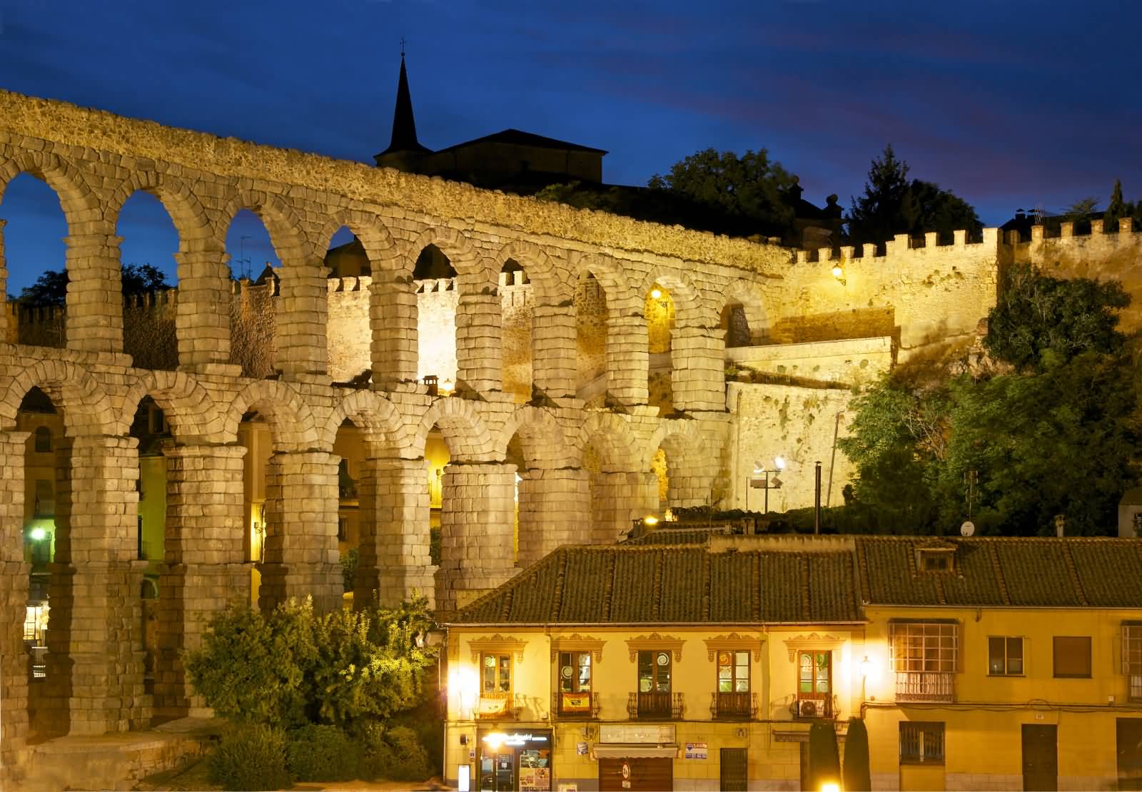 Aqueduct Of Segovia City Wall Lit Up At Night