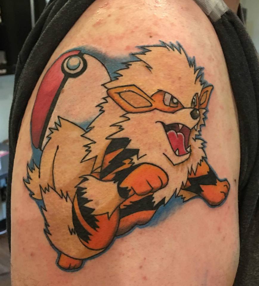 Arcanine With Pokemon Ball Tattoo On Right Shoulder