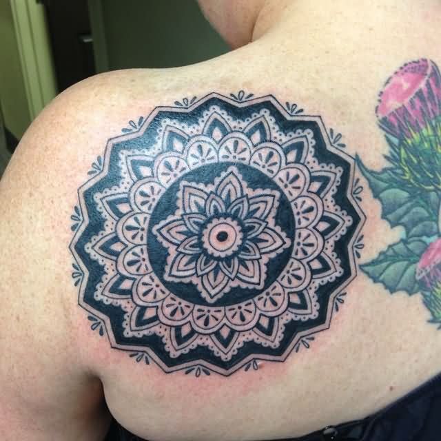 Attractive Black Ink Flower Tattoo On Left Back Shoulder