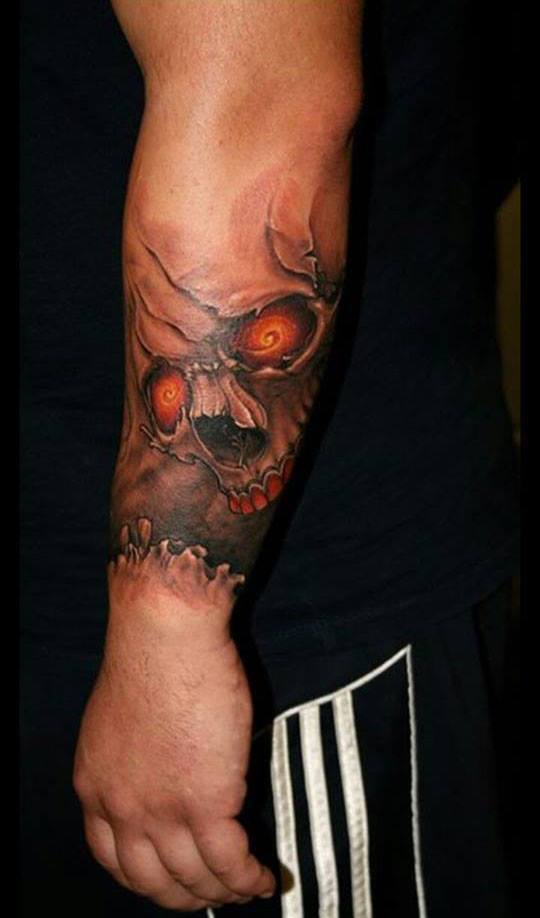 Attractive Skull Tattoo On Left Arm By Jeff Norton