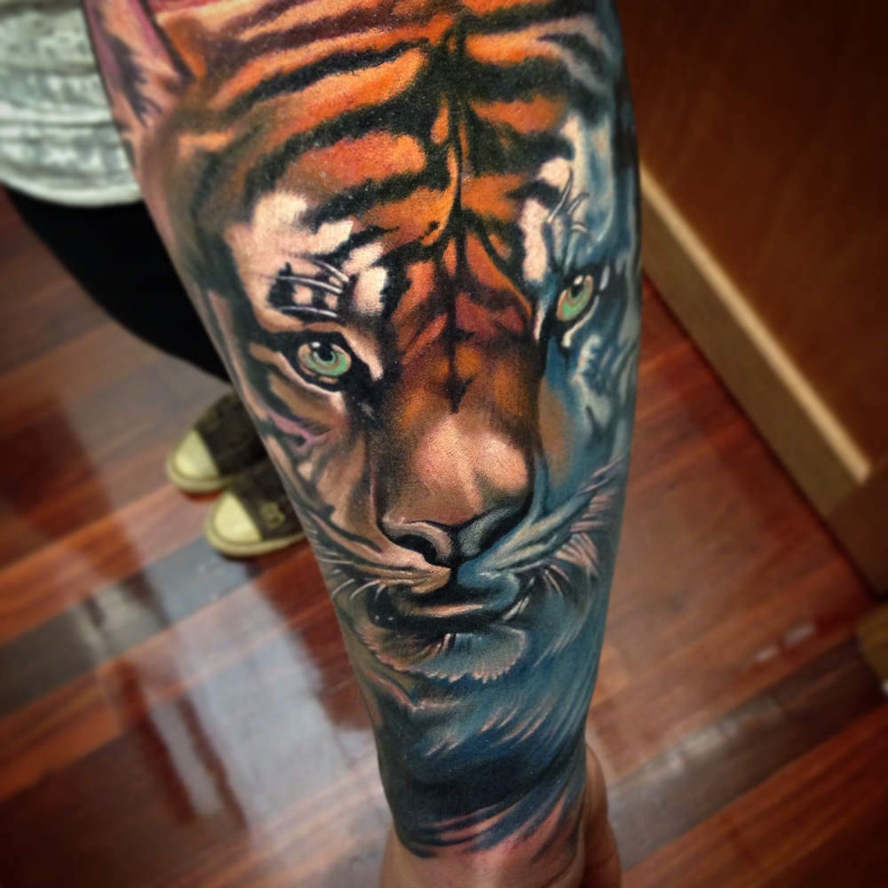 Attractive Tiger Head Tattoo On Left Arm