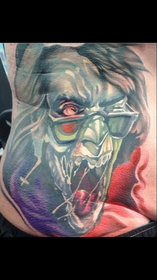 Attractive Zombie Face Tattoo On Man Right Side Rib By Fabz