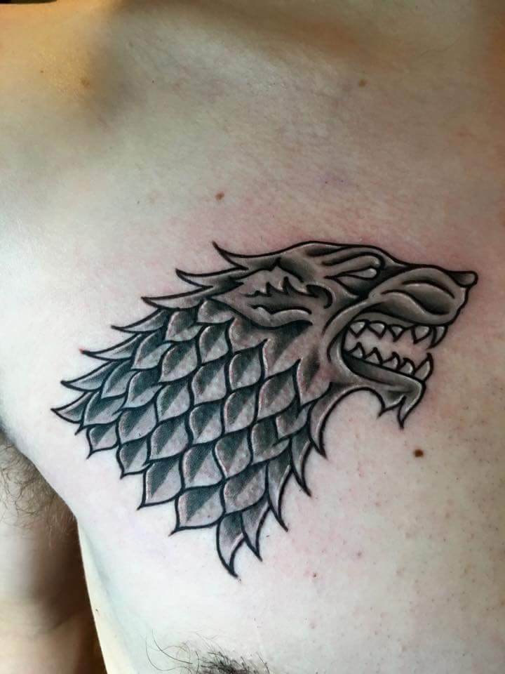 Awesome Black Ink Dire Wolf Head Tattoo On Man Right Front Chest By Zak Schulte