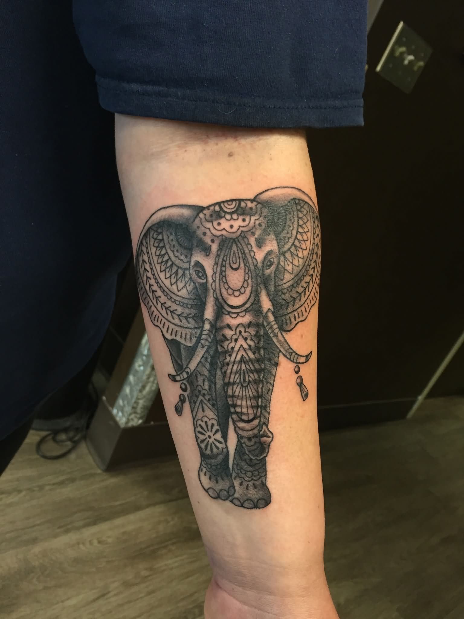 Awesome Black Ink Elephant Tattoo On Left Forearm By Daniel Troyer