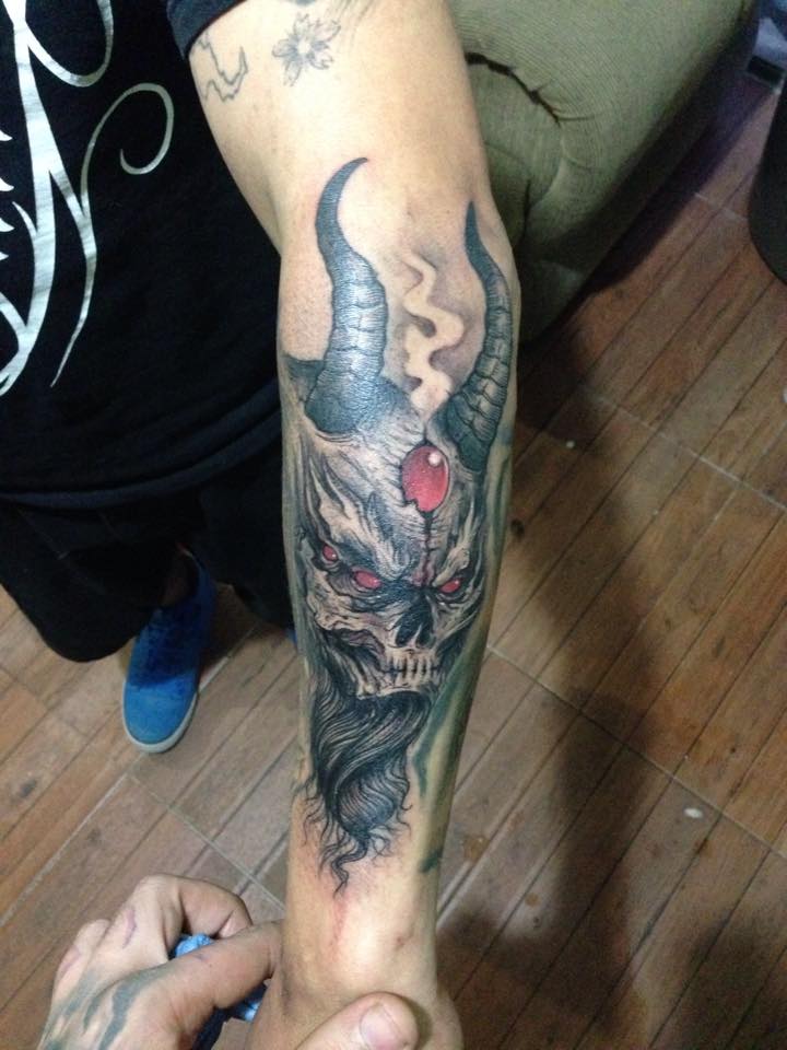 Awesome Devil Skull Tattoo On Man Left Arm By Pig Legion