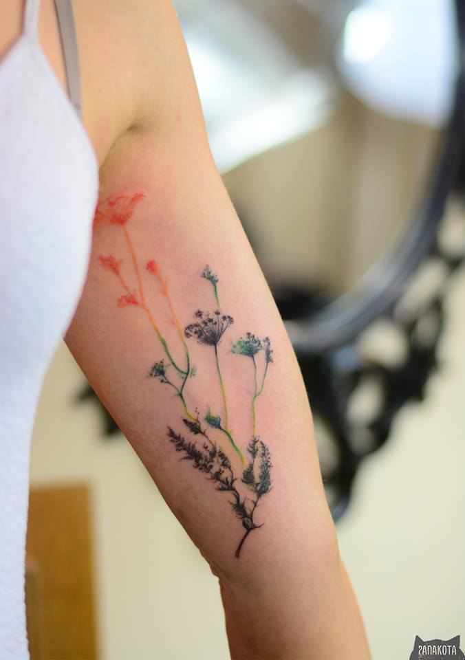 Awesome Flowers Tattoo On Left Bicep By Panakota