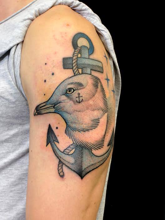 Bird Head With Anchor Tattoo On Left Half Sleeve