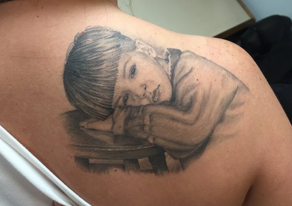 Black And Grey Boy Portrait Tattoo On Right Back Shoulder
