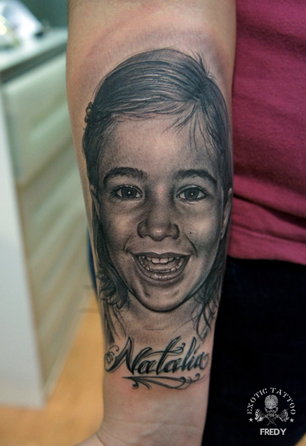Black And Grey Girl Face Tattoo On Right Forearm By Fredy