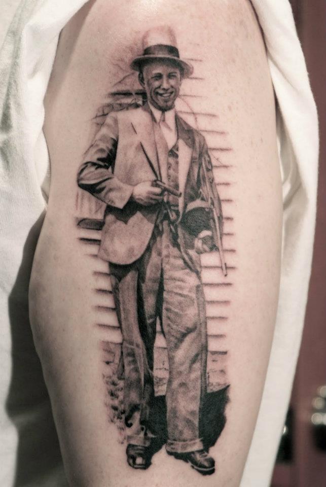 Black And Grey John Dillinger Tattoo On Half Sleeve