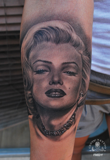 Black And Grey Marilyn Monroe Portrait Tattoo On Forearm