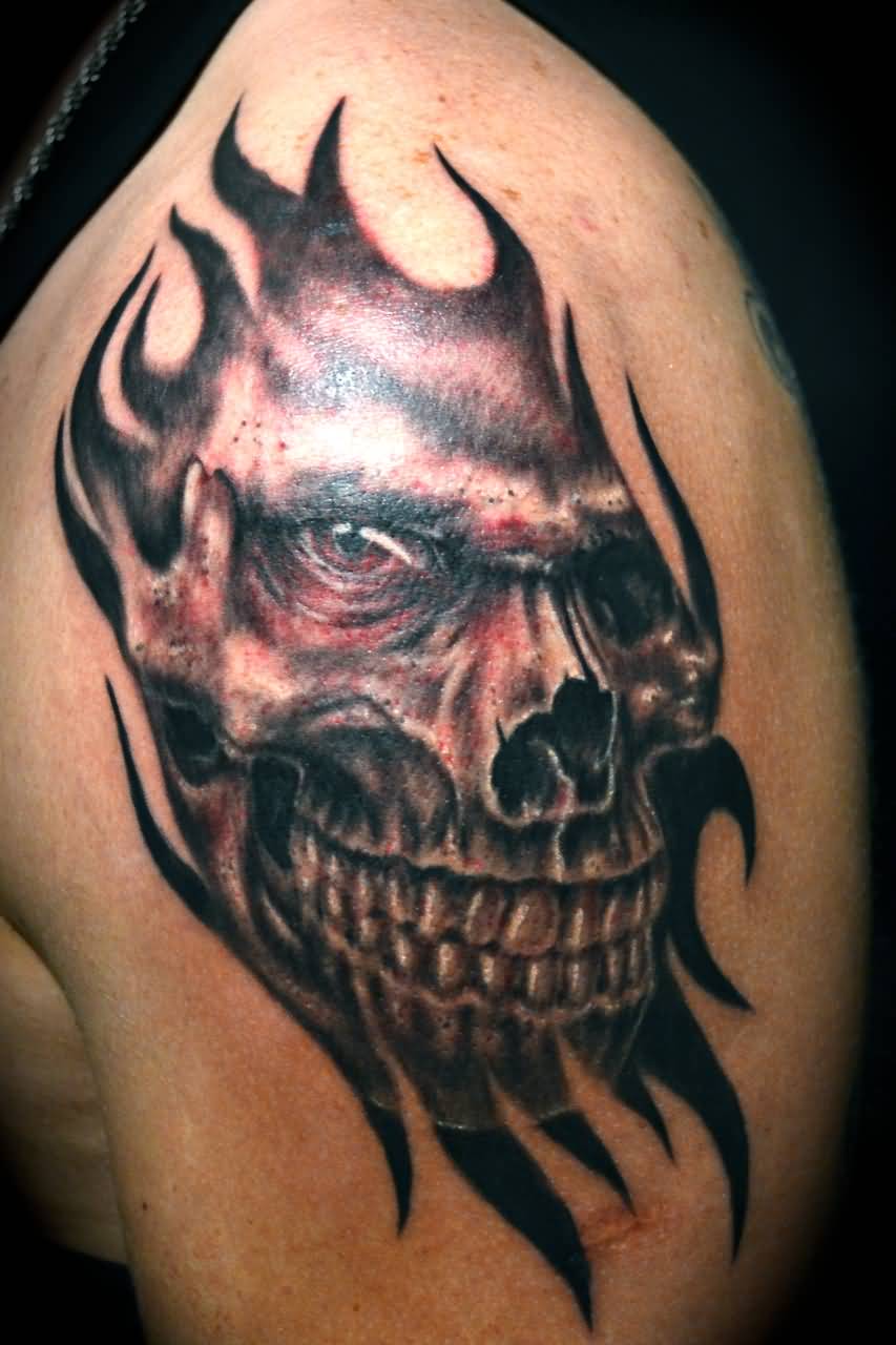 Black And Grey Ripped Skin Skull Tattoo On Left Shoulder
