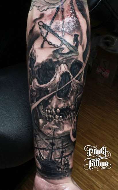 Black And Grey Skull Tattoo On Forearm