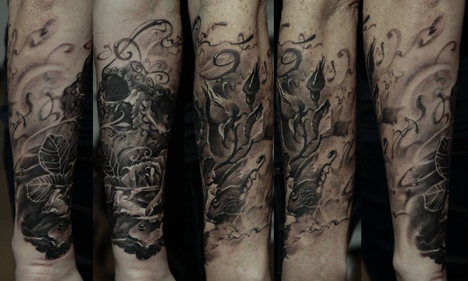Black And Grey Skull With Rose Tattoo On Right Forearm