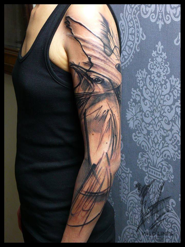 Black Ink Abstract Bird Tattoo On Man Left Half Sleeve