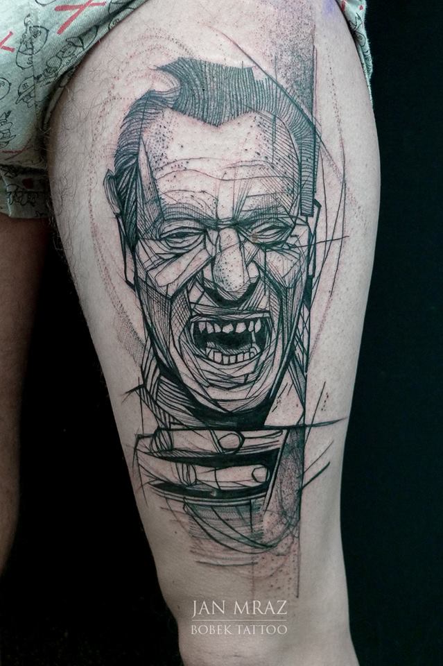 Black Ink Abstract Bukowski Face Tattoo On Thigh