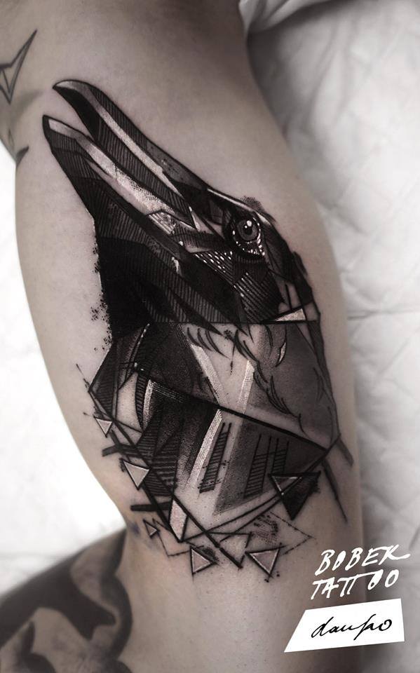 Black Ink Abstract Crow Head Tattoo On Bicep