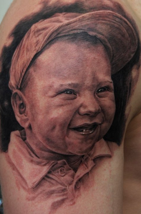 Black Ink Baby Portrait Tattoo On Right Shoulder