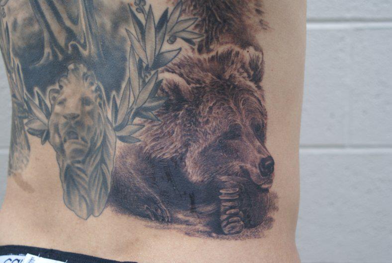Black Ink Bear Tattoo On Lower Back