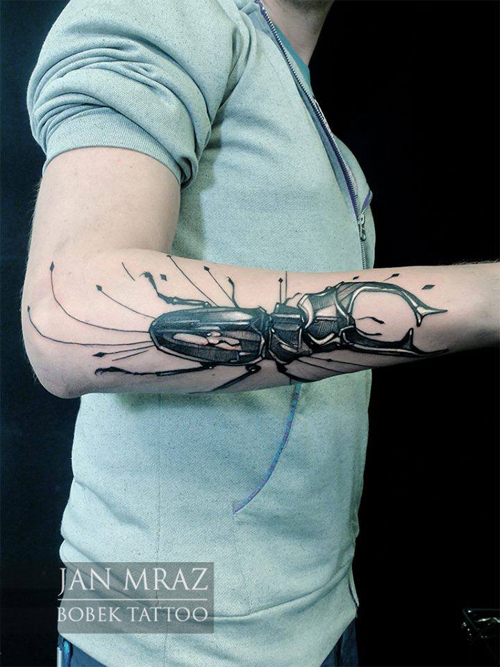 Black Ink Beetle Tattoo On Right Arm