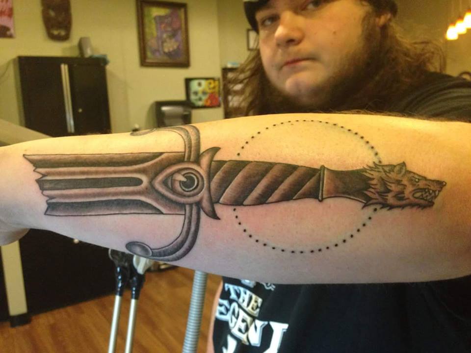 Black Ink Broken Sword Tattoo On Man Left Arm