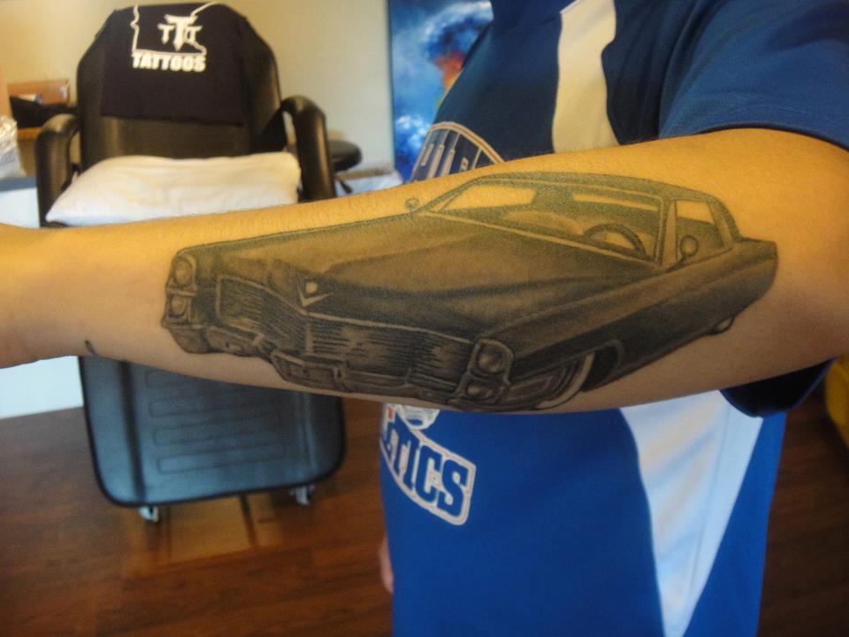 Black Ink Cadillac Car Tattoo On Left Arm