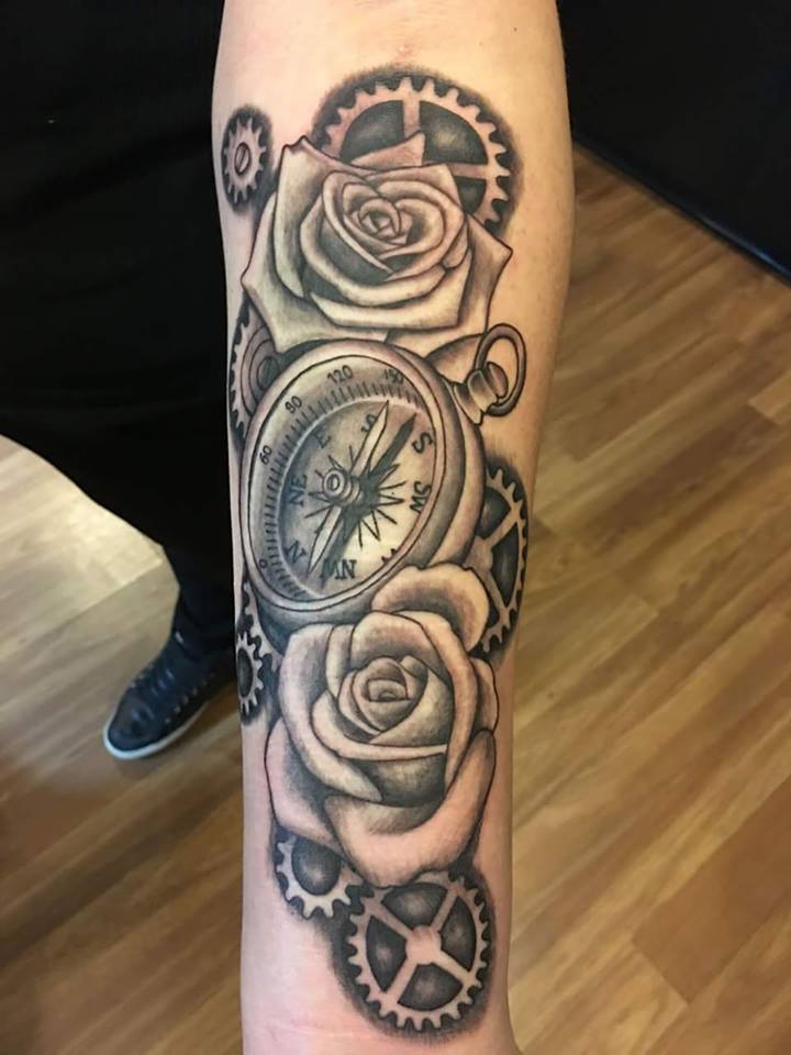 Black Ink Compass With Roses And Gears Tattoo On Left Forearm