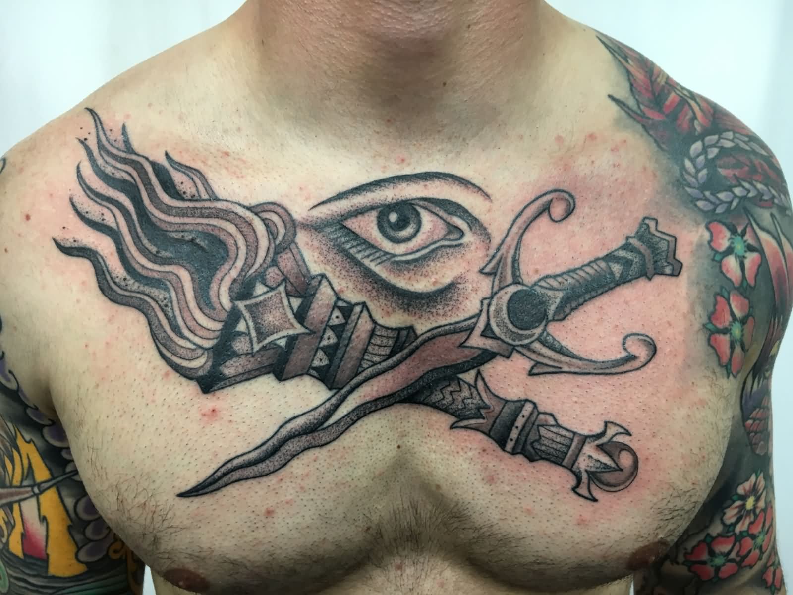 Black Ink Dotwork Flambeau With Sword And Eye Tattoo On Man Chest