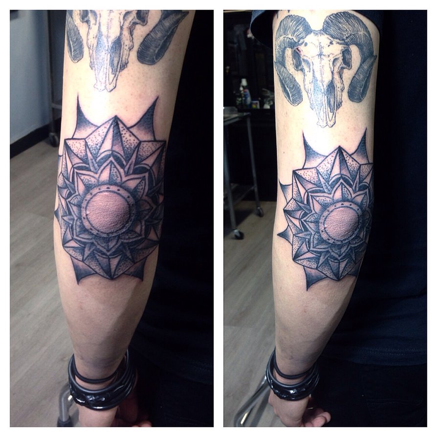 Black Ink Dotwork Mandala Flower Tattoo On Left Elbow