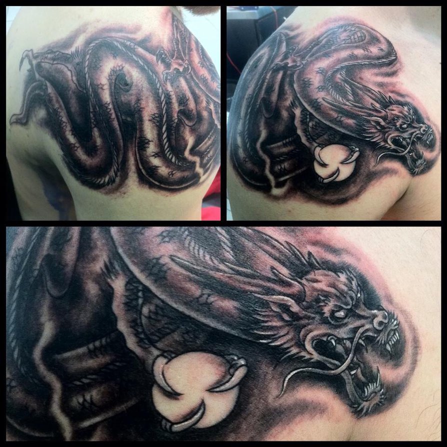 Black Ink Dragon Tattoo On Man Right Shoulder